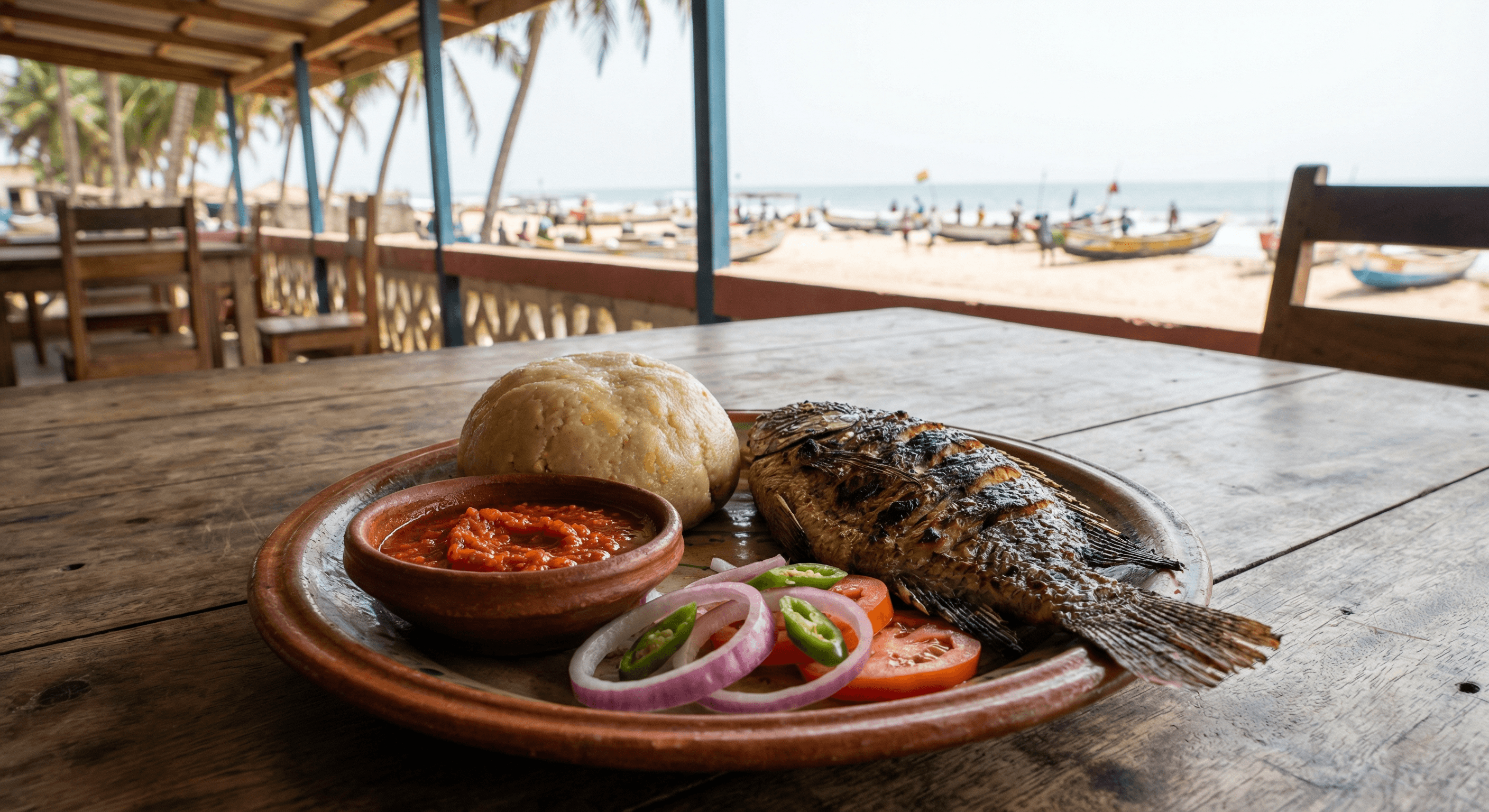 Banku and tilapia with pepper sauce